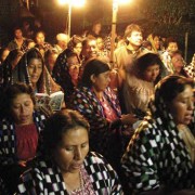 Hundreds of women line the streets and participate in their colorful shawls; young women, little girls, and grandmothers wear the white lacy veils that mark their devotion. (photo: Victoria Stone)