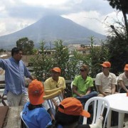 A guided tour group prepares to journey to the celebrations at Santiago Sacatepéquez