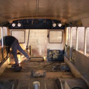 The bus interior is completely gutted, windows and seats are removed and bad parts are replaced.