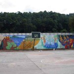 Putting the finishing touches on the mural at Escuela Mariano Navarrete