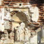 Sculpture of the child Mary in upper niche of Church of Nuestra Señora de los Remedios