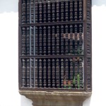 Wooden window spindles and stone base