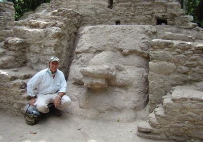 Dr. Hansen with mask on excavated structure