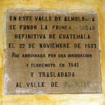 Plaque on wall of Ciudad Vieja municipal building claims founding of the first city of Guatemala in 1527 and its ruin by flood and earthquake in 1541.