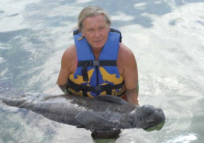 Author Janson makes friends with a young manatee
