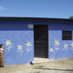 A young girl decorates her family’s new home.