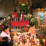 Worshipers climb the stairs leading to the altar by Thor Janson