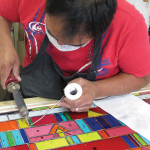 Putting the finishing touches on the stained glass window