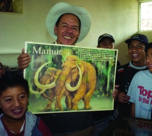 Caretaker Alvarado gives museum  tours to school children.