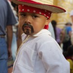 Child dressed for the Feast of Our Lady of Guadalupe in Antigua Guatemala (photo by Cesar Tian)