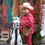 Child dressed in typical clothing for the Feast of Our Lady of Guadalupe in Antigua Guatemala (photo by Cesar Tian)