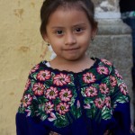 Girl dressed in typical clothing for the Feast of Our Lady of Guadalupe in Antigua Guatemala (photo by Cesar Tian)