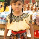 Girl dressed in typical clothing for the Feast of Our Lady of Guadalupe in Antigua Guatemala (photo by Luis Toribio)