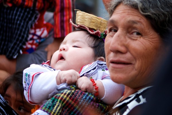 Grandmother and her granddaughter bonding for the Feast of Our Lady of Guadalupe in Antigua Guatemala (photo by Rudy Girón)