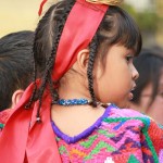 Girl dressed with typical clothing for the Feast of Our Lady of Guadalupe in Antigua Guatemala (photo by Rudy Giron)