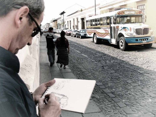 Photographer drawing a bus (image by photos.rudygiron.com)