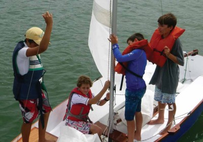 A group of future sailors learn the craft through hands-on experience.