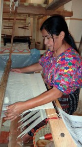 Lidia works on her latest creation using a foot pedal loom