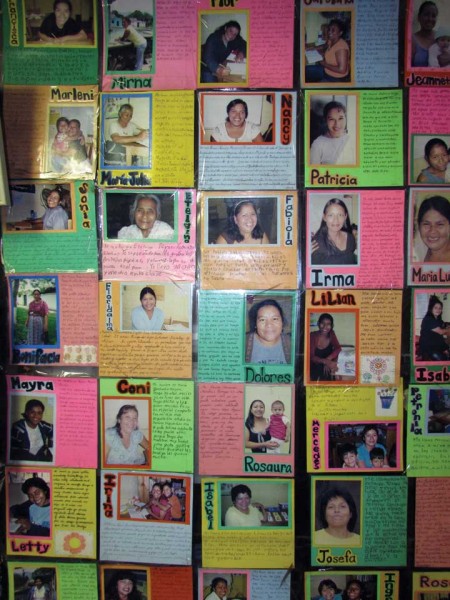 A wall in Camino Seguro’s office is covered with pictures of adults who have graduated from elementary school through its programs.