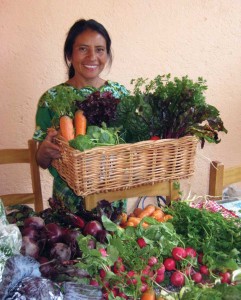 Elena with a fresh batch of organic produce