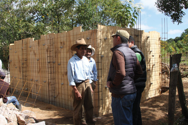 Project Manager and Engineer at site of water distribution tank