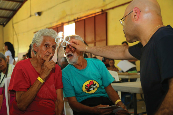 Comfort Optical: A patient receives an eye exam at a medical site set up at Casa Social Del Maestro Prof. Leopoldo in Puerto Barrios. (U.S. Army photo by PFC. Tomarius Roberts)